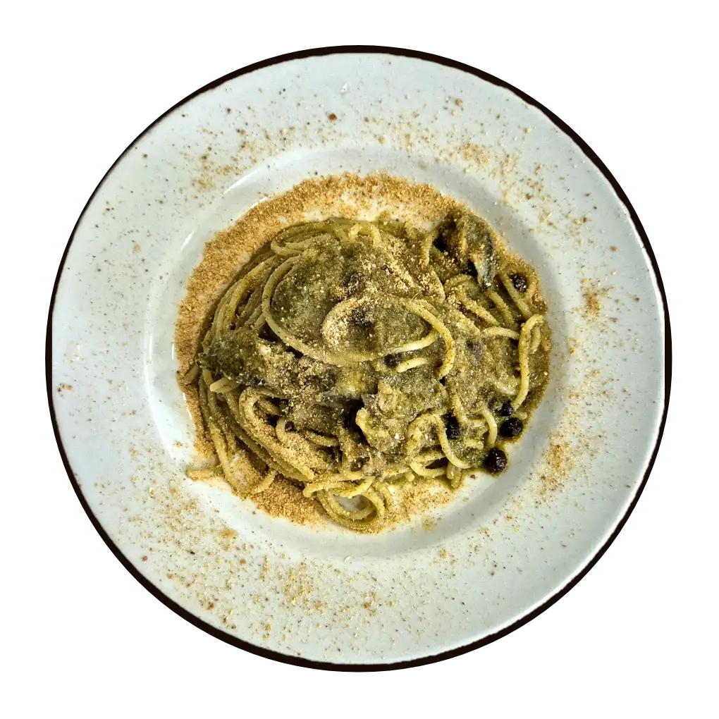 Pasta con le sarde coperta di mollica atturrata, con finocchietto e pinoli